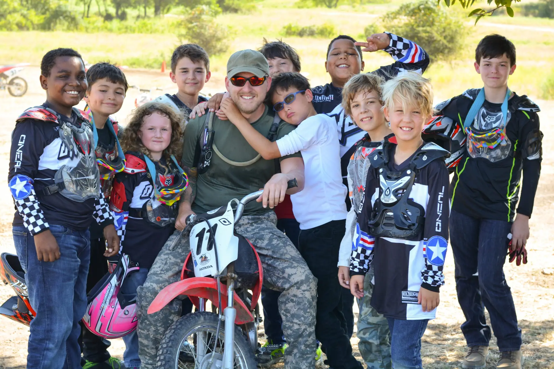 Motorcycle Summer Camp Coach Medic with Campers at Iron Horse Country