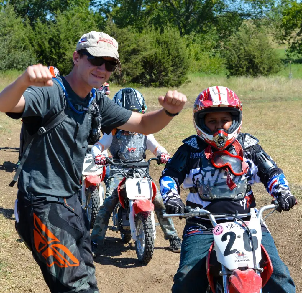 Junior Coach teaching summer camp motorcycle riders