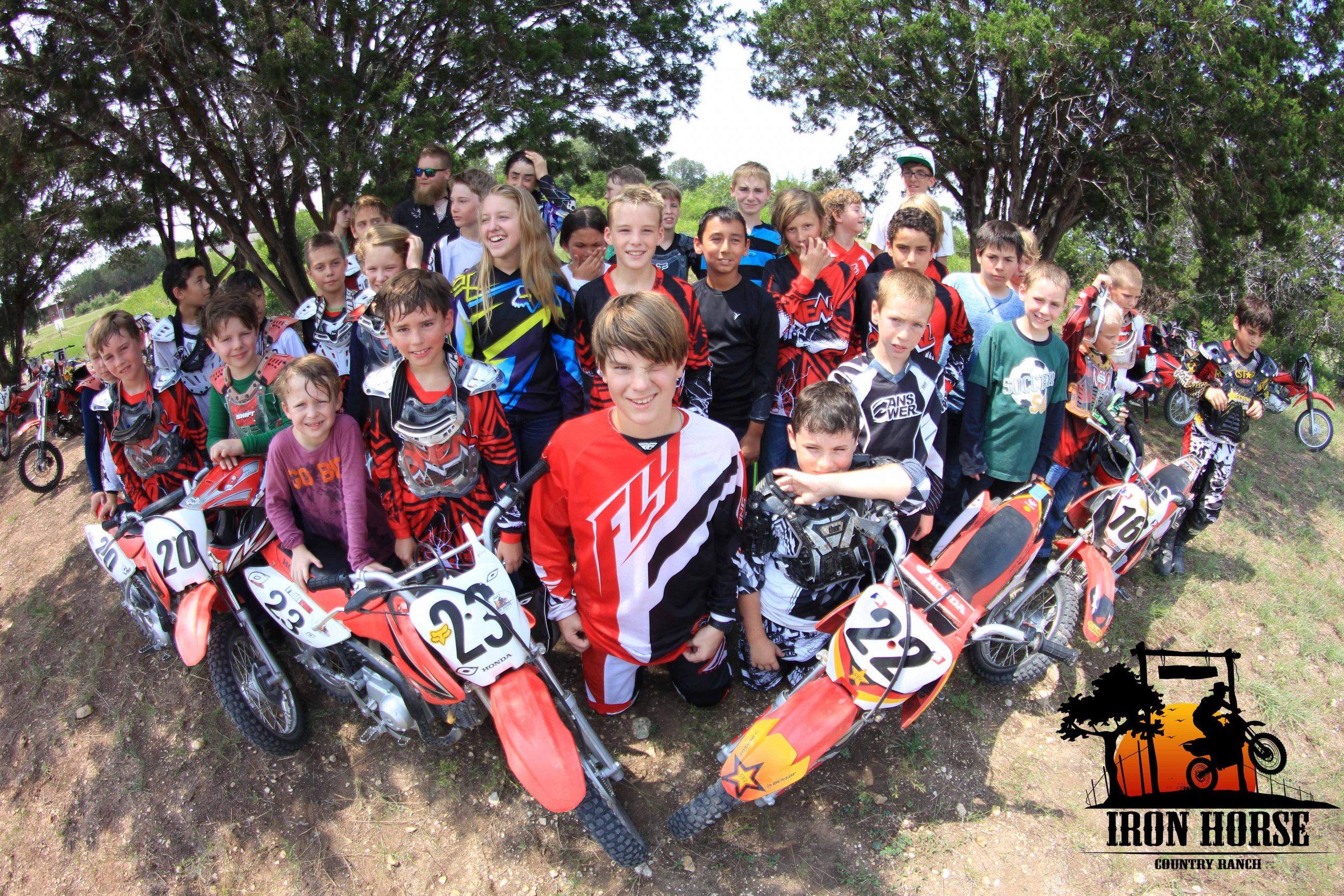 Summer Camp motocross children group photo with Honda motorcycles