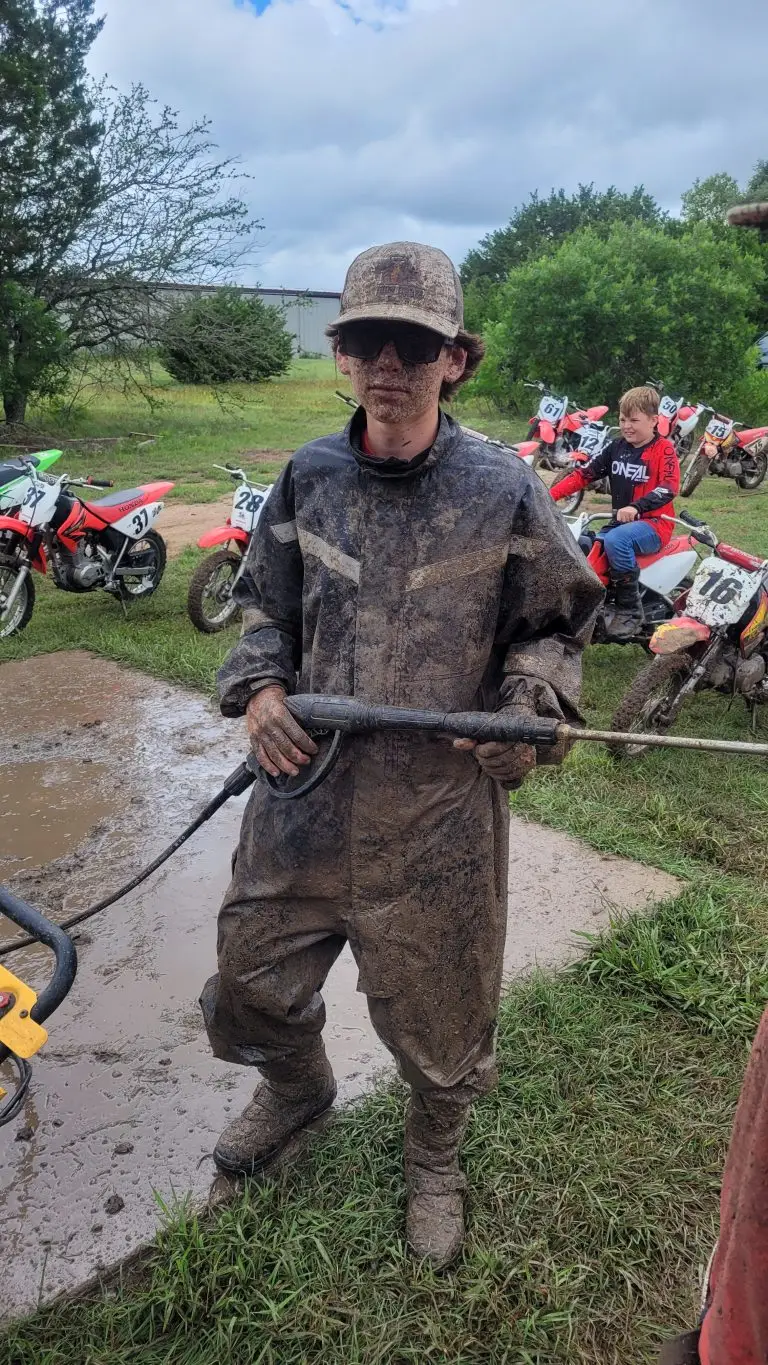 Coaches Counselors washing dirt bikes at Summer Camp at Iron Horse Country