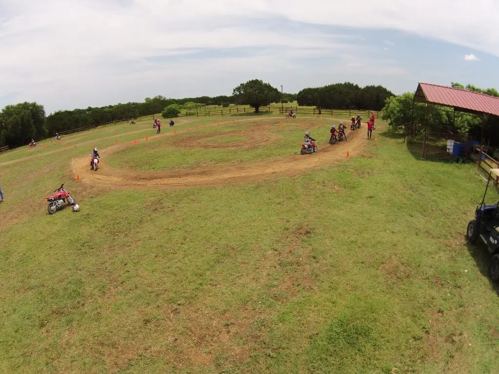 Summer Campers practicing on Circle 8 track at Iron Horse Country motocross camp