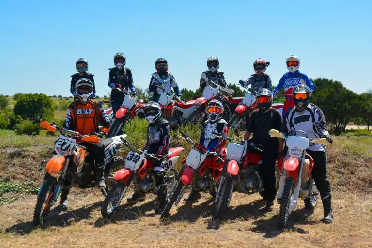 Group of kids on Honda dirt bikes at Iron Horse country summer camp jump
