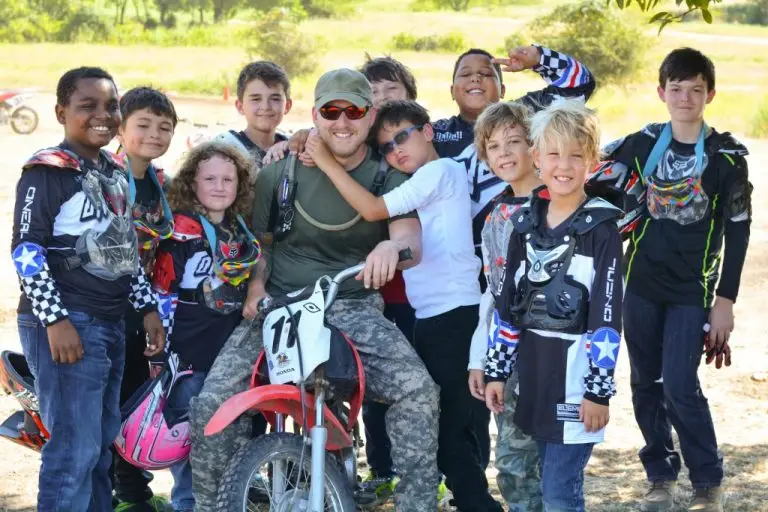 Coach campers on motorcycles outdoor sports activities in summer camp at Iron Horse Country Ranch