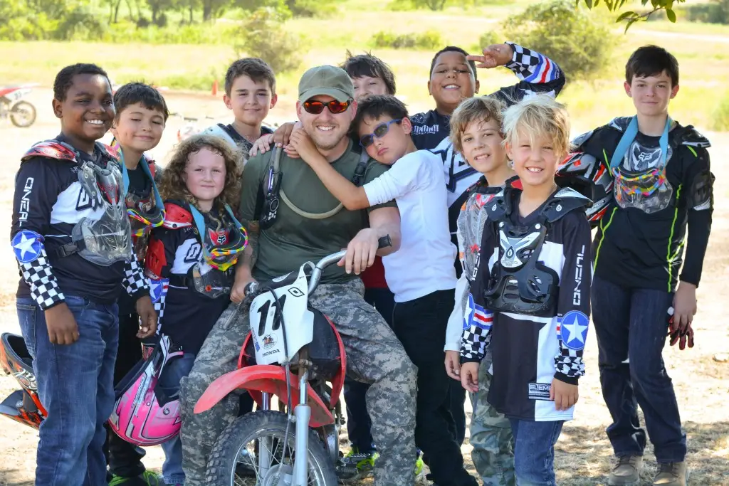 Coach campers on motorcycles outdoor sports activities in summer camp at Iron Horse Country Ranch