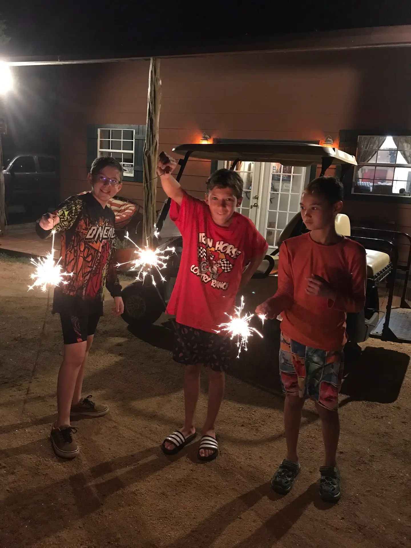Dirt Bike Camp fireworks at night time kids with sparklers