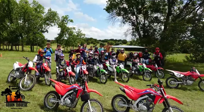 summer camp children children outside activities, riding dirt bikes