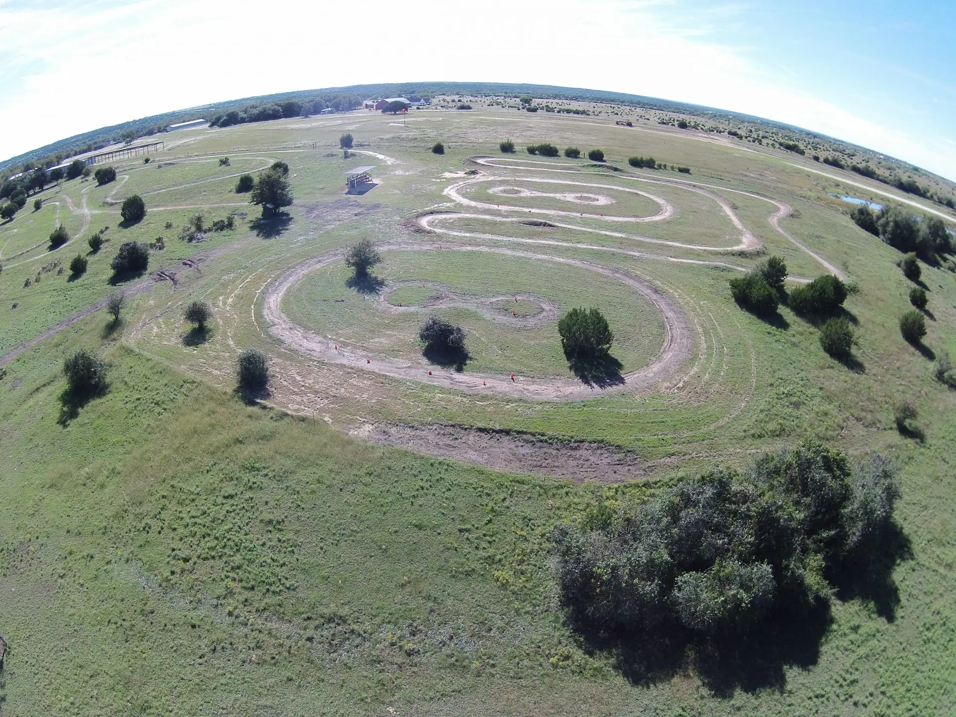 Aerial view of motorcycle dirt tracks at summer camp at iron horse country