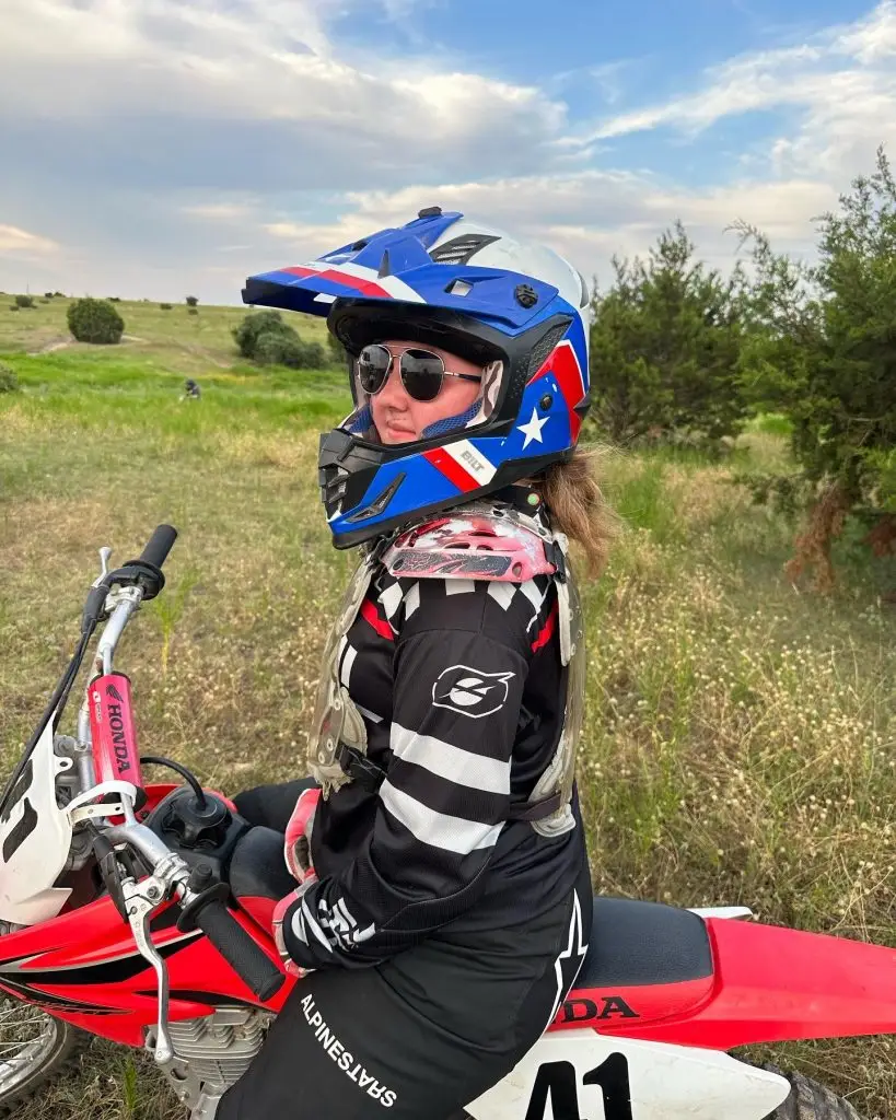 Girl summer camper on Honda 125 at iron horse country motocross summer camp
